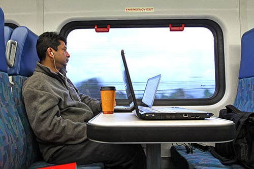 Metrolink rider looking out the window of the train.