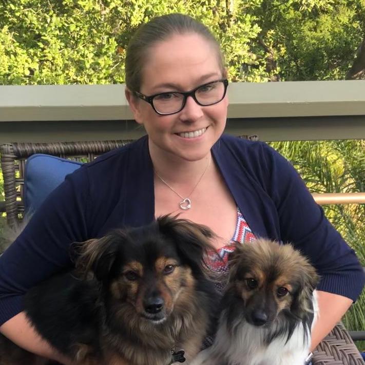 Headshot of Amber M with her dogs