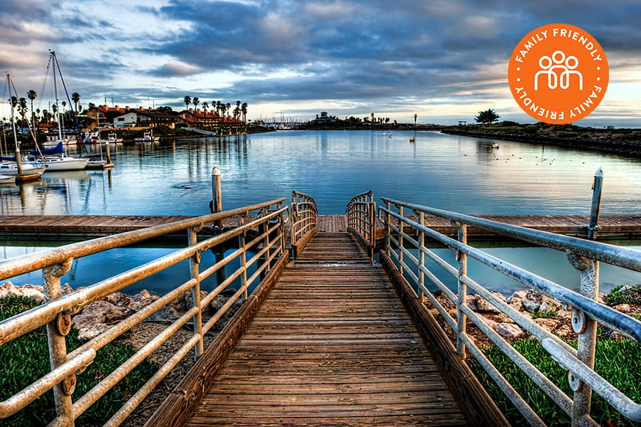 Wooden dock on Marina Park. Image stamped with Family Friendly badge
