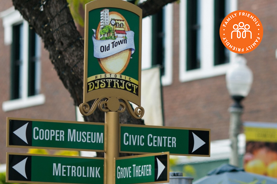 Street signage of the Old Town  Historic District. Cooper Museum and Metrolink to the left, Civic Center to the right and Grove Theater to the south. Image includes Family Friendly Badge.